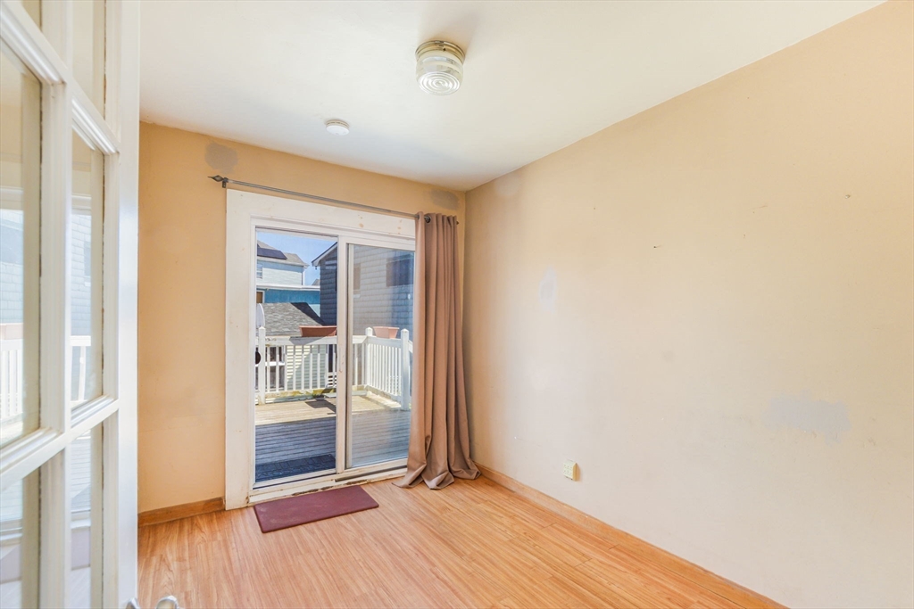 58 Downing Street Fall River, MA 02723 - Photo 11 of 41 a view of a room with wooden floor and a bathroom
