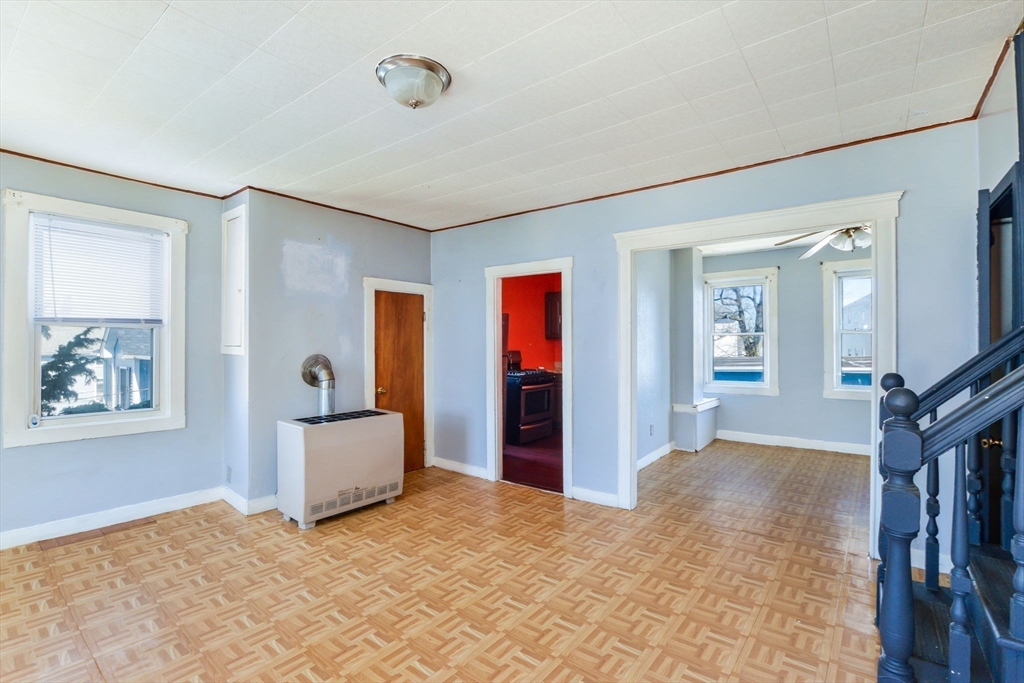 58 Downing Street Fall River, MA 02723 - Photo 14 of 41 wooden floor and windows in a room