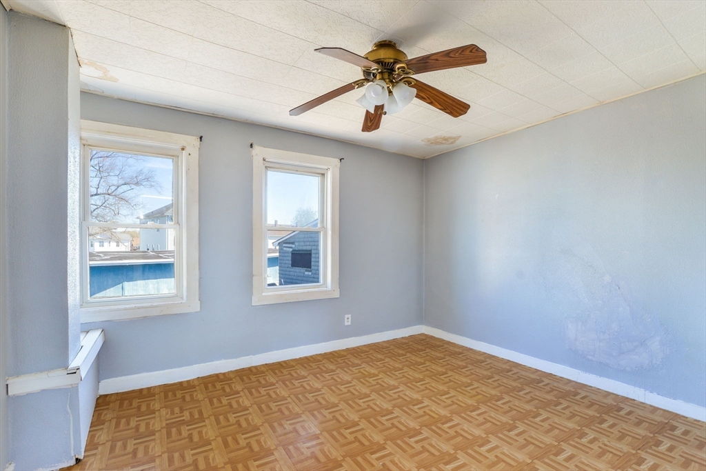 58 Downing Street Fall River, MA 02723 - Photo 16 of 41 a view of an empty room with a window