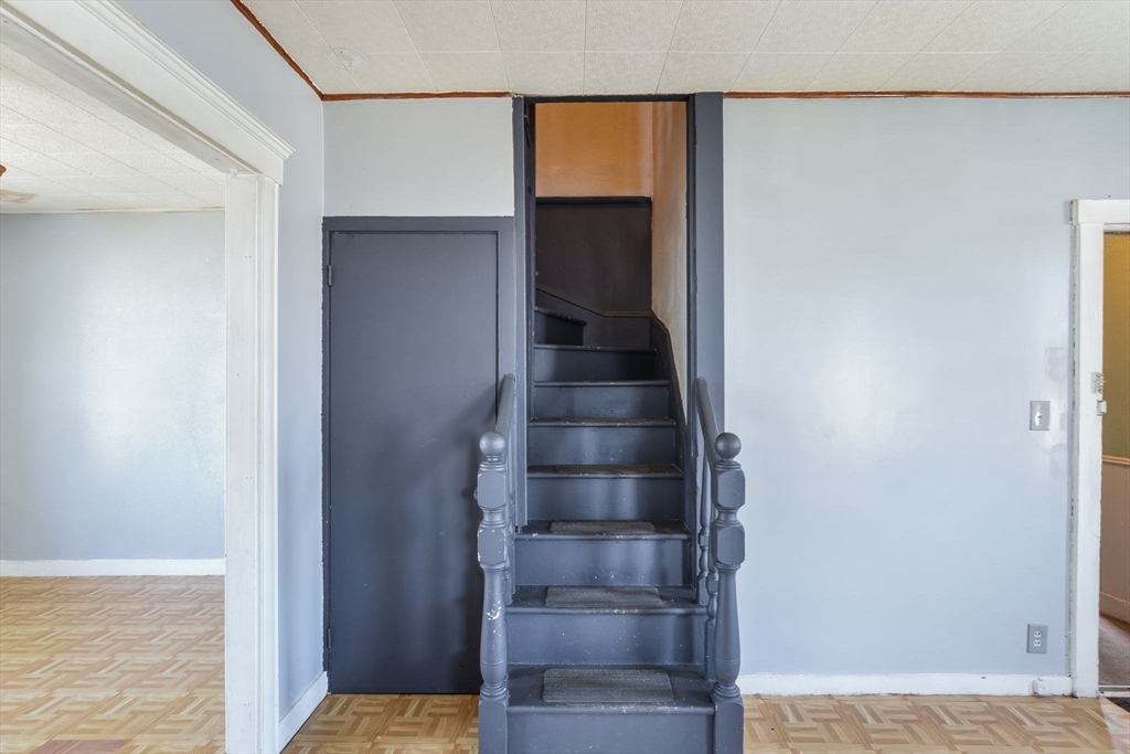 58 Downing Street Fall River, MA 02723 - Photo 19 of 41 a view of entryway and hall with wooden floor