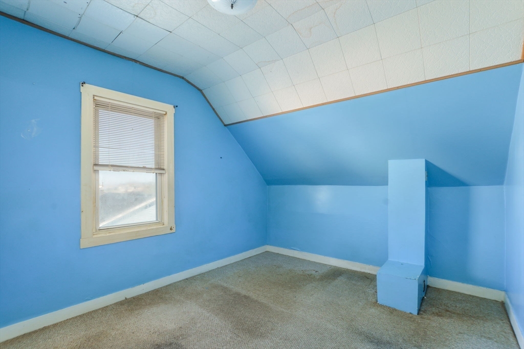 58 Downing Street Fall River, MA 02723 - Photo 23 of 41 a view of an empty room with a window