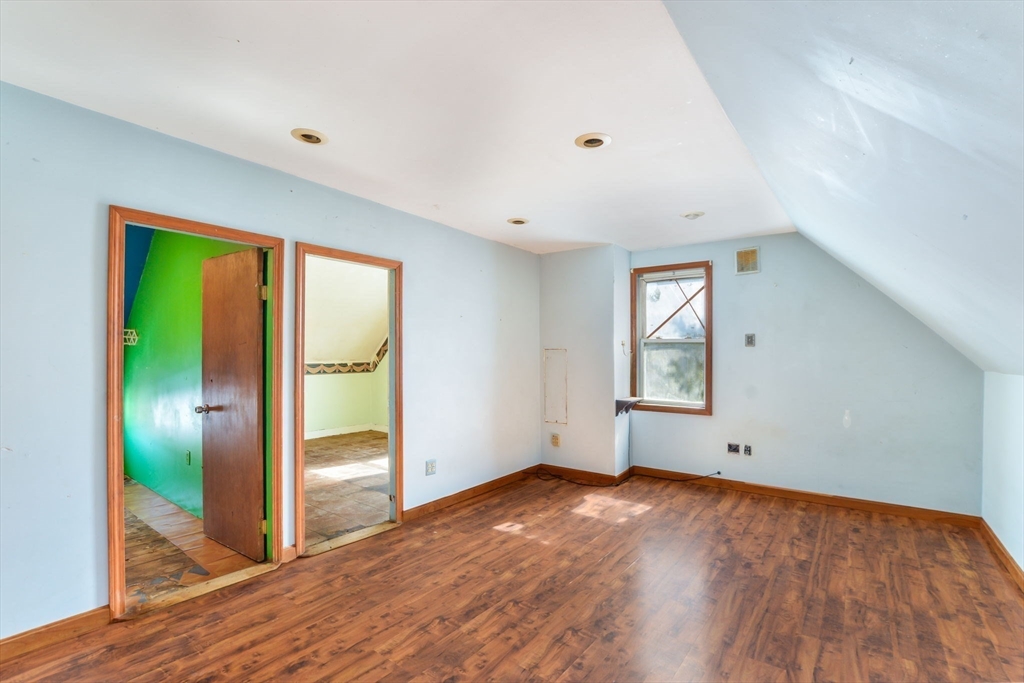 58 Downing Street Fall River, MA 02723 - Photo 32 of 41 a view of empty room with wooden floor and fan