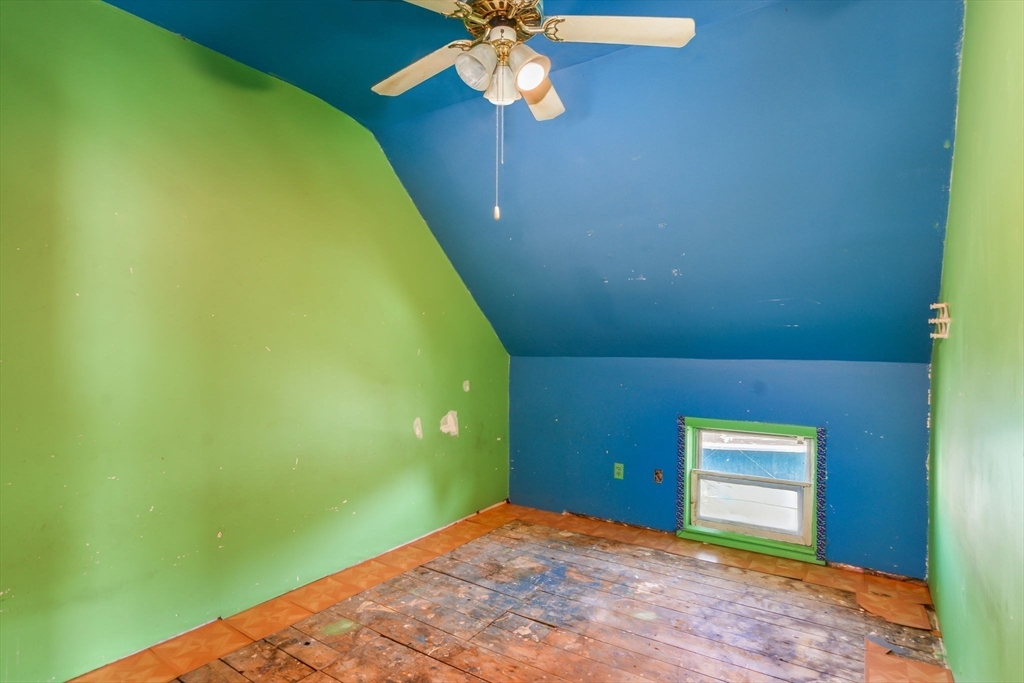 58 Downing Street Fall River, MA 02723 - Photo 34 of 41 a view of a big room with chandelier fan and carpet