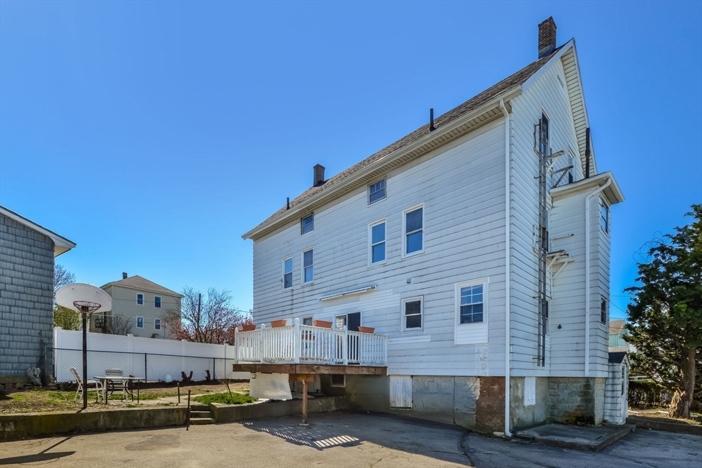 58 Downing Street Fall River, MA 02723 - Photo 39 of 41 a view of a building with wooden fence