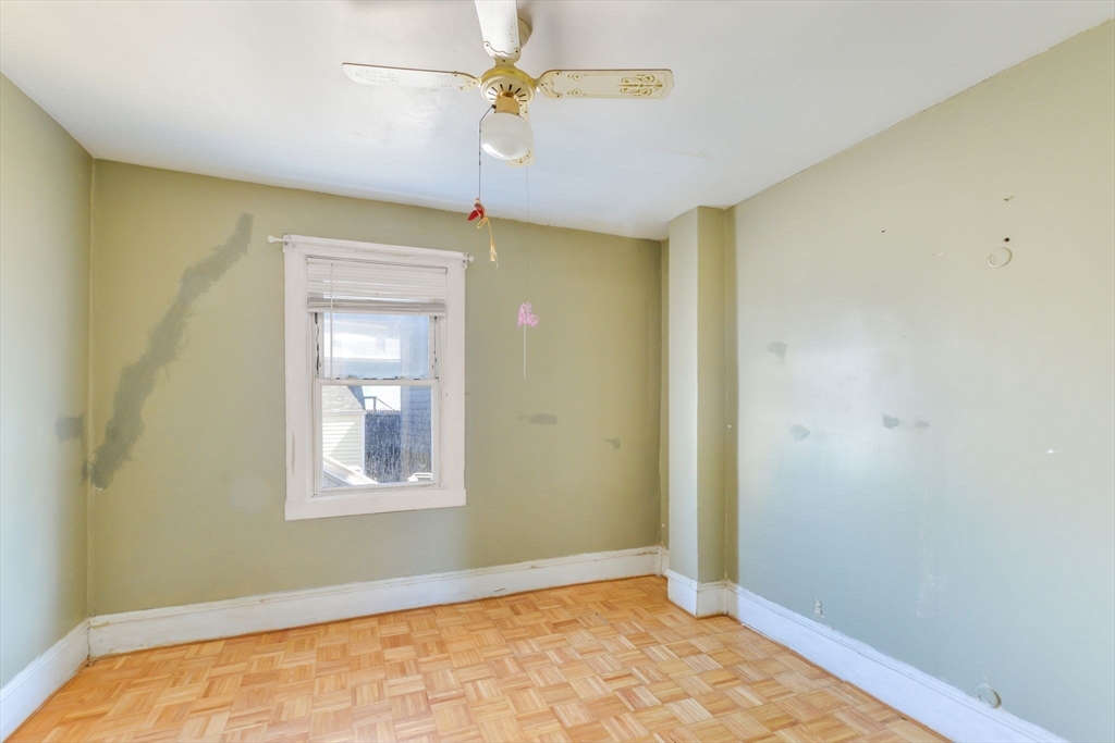 58 Downing Street Fall River, MA 02723 - Photo 10 of 41 a view of empty room with a window and ceiling fan