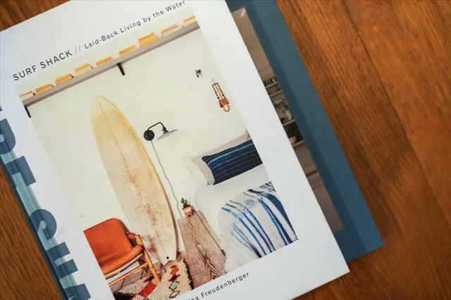 a dining table with chairs and potted plant on counter