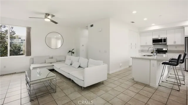 a living room with furniture and a painting