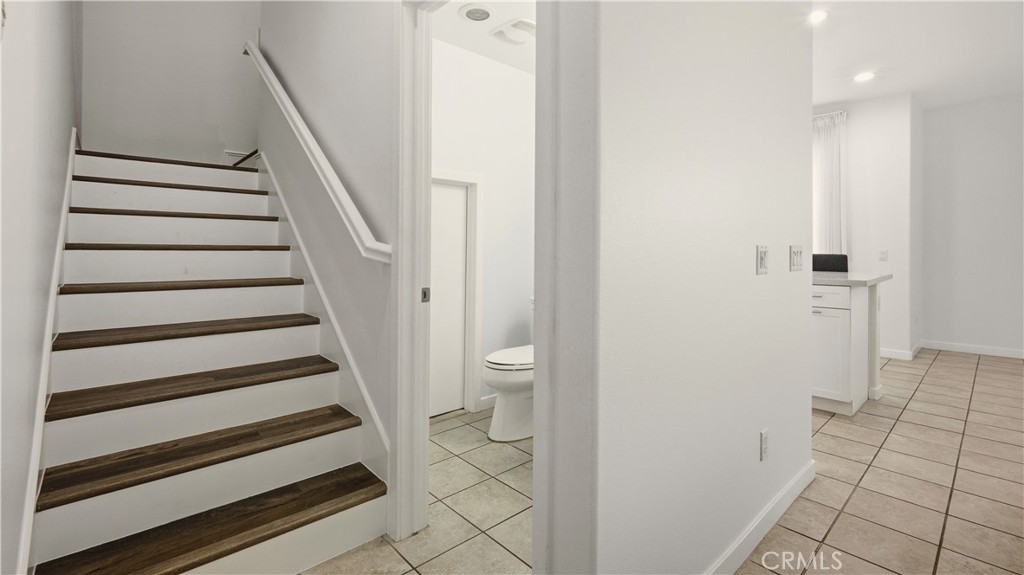 713 South Azusa Avenue, Unit A Azusa, CA 91702 - Photo 17 of 31 a view of entryway with wooden floor and stairs