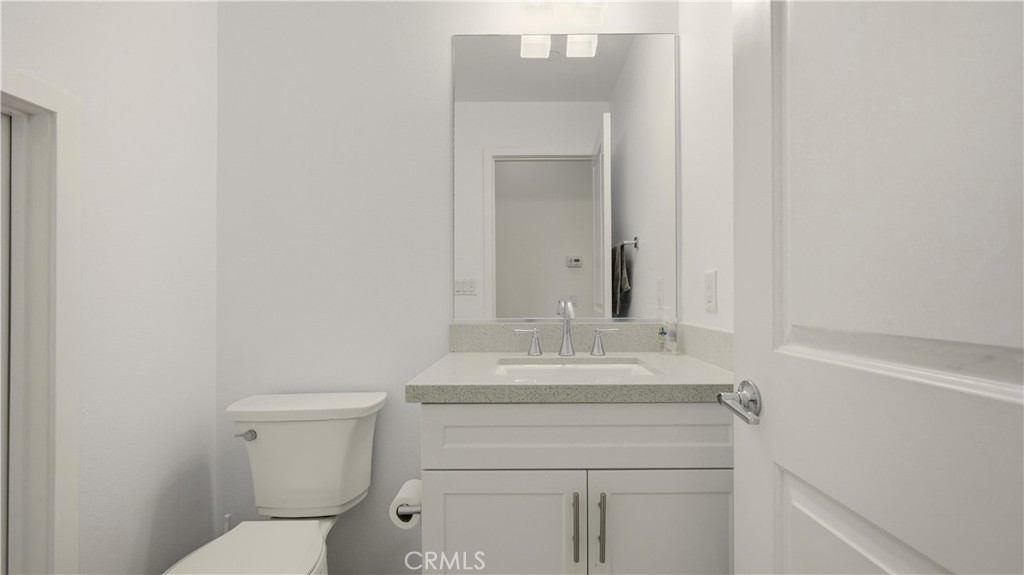 713 South Azusa Avenue, Unit A Azusa, CA 91702 - Photo 18 of 31 a bathroom with a sink toilet and mirror