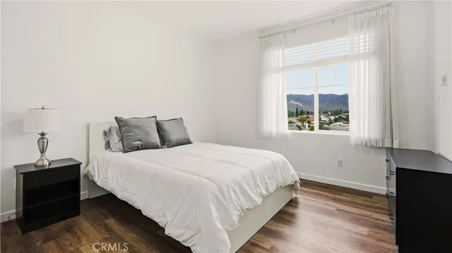 a bathroom with a double vanity sink mirror and shower