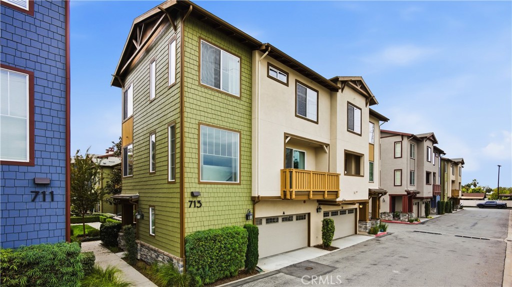 713 South Azusa Avenue, Unit A Azusa, CA 91702 - Photo 2 of 31 a front view of a residential apartment building with a yard