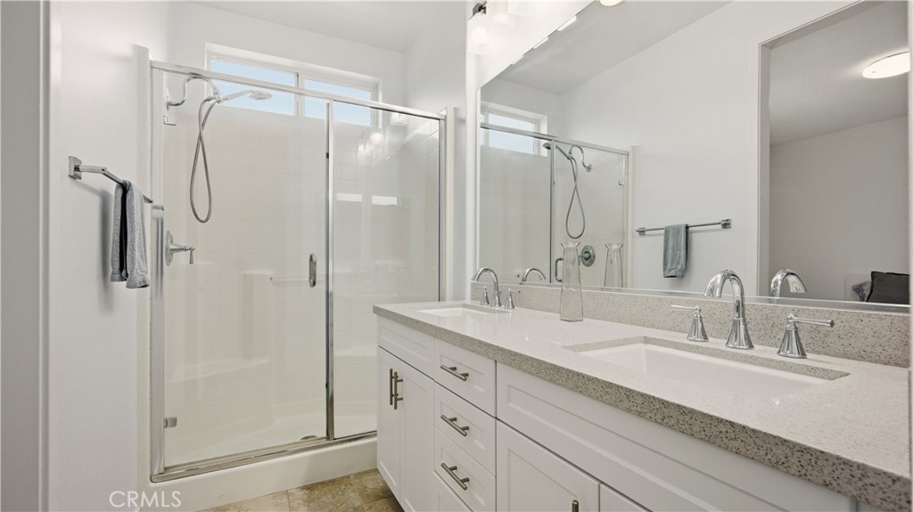 713 South Azusa Avenue, Unit A Azusa, CA 91702 - Photo 22 of 31 a bathroom with a double vanity sink mirror and shower