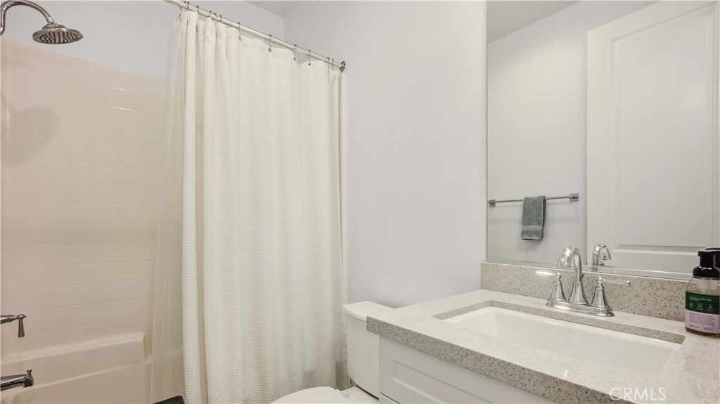 713 South Azusa Avenue, Unit A Azusa, CA 91702 - Photo 23 of 31 a bathroom with a sink and a mirror