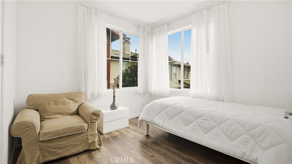 713 South Azusa Avenue, Unit A Azusa, CA 91702 - Photo 24 of 31 a bedroom with a bed couch and window