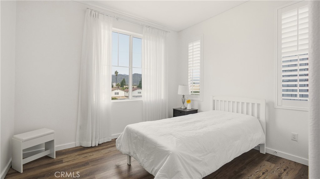 713 South Azusa Avenue, Unit A Azusa, CA 91702 - Photo 25 of 31 a bedroom with a bed and a window