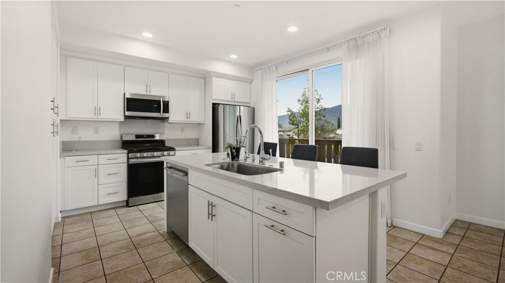 713 South Azusa Avenue, Unit A Azusa, CA 91702 - Photo 9 of 31 a kitchen with a sink stove and refrigerator