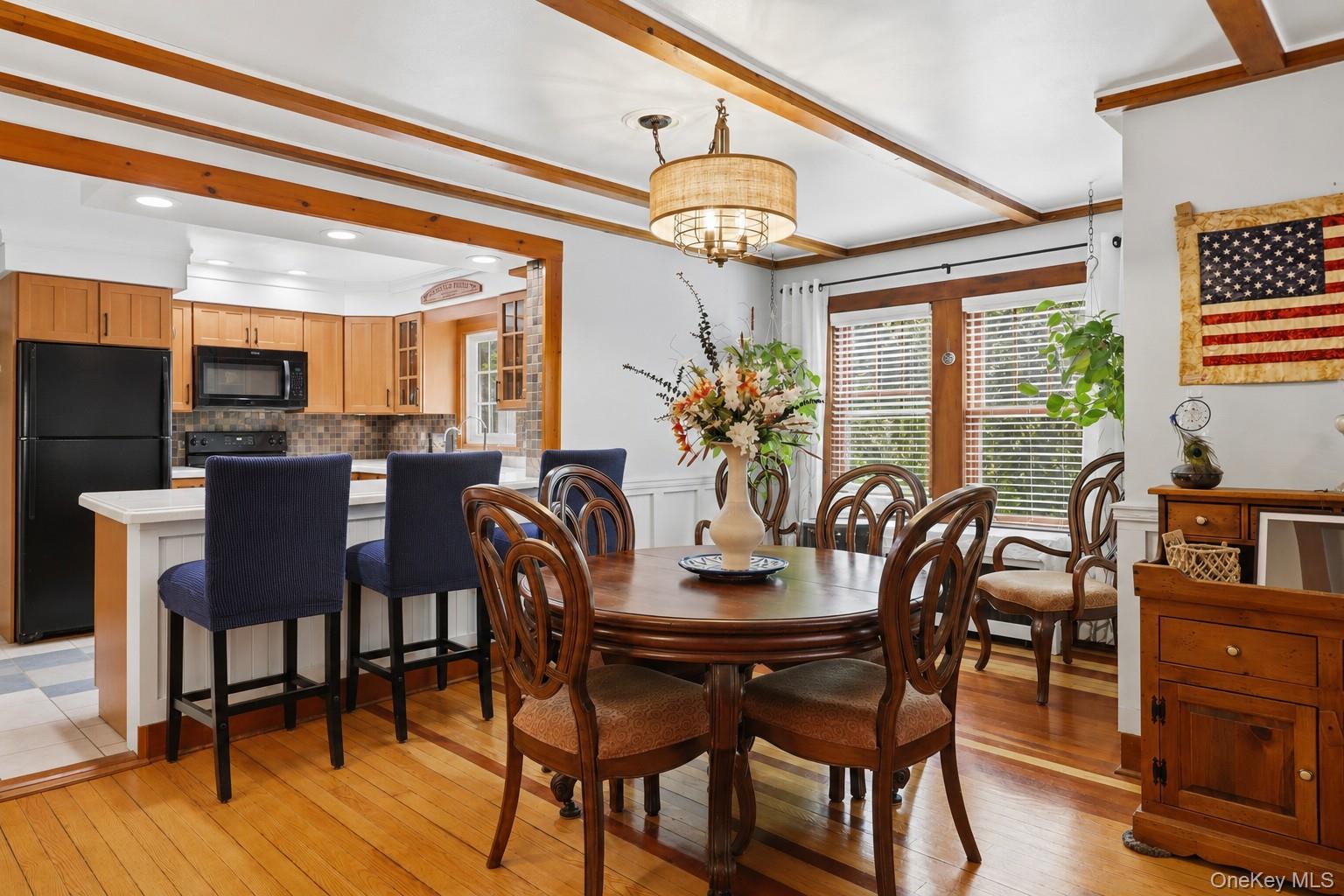 115 Cold Spring Road Liberty, NY 12754 - Photo 7 of 35 Cozy farmhouse dining and kitchen space with warm and inviting hardwood floors, wood details and large windows.