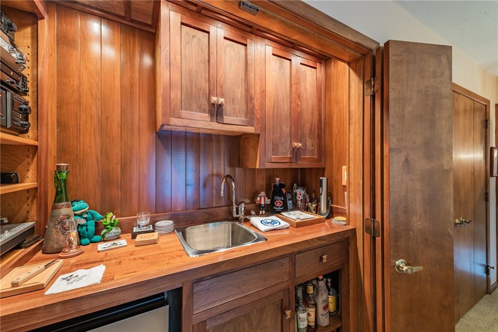 421 Center Church Road McMurray, PA 15317 - Photo 19 of 25 WET BAR - Built in wet bar with a sink, mini fridge, and cabinets.