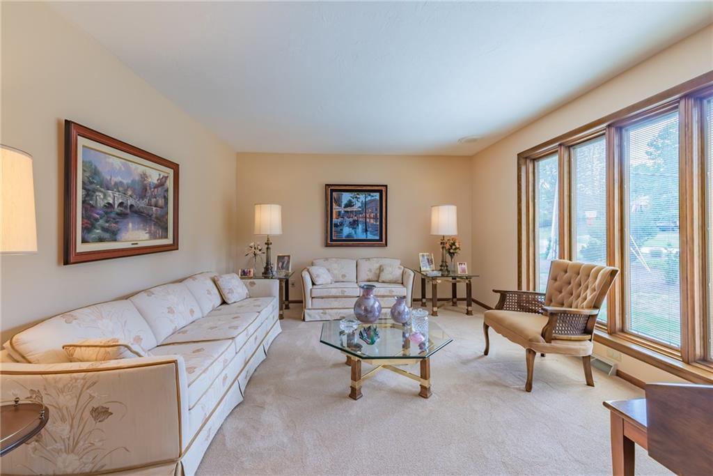 421 Center Church Road McMurray, PA 15317 - Photo 3 of 25 LIVING ROOM - Neutral carpeting and walls, wall of floor to ceiling windows that allows light to flow inside.
