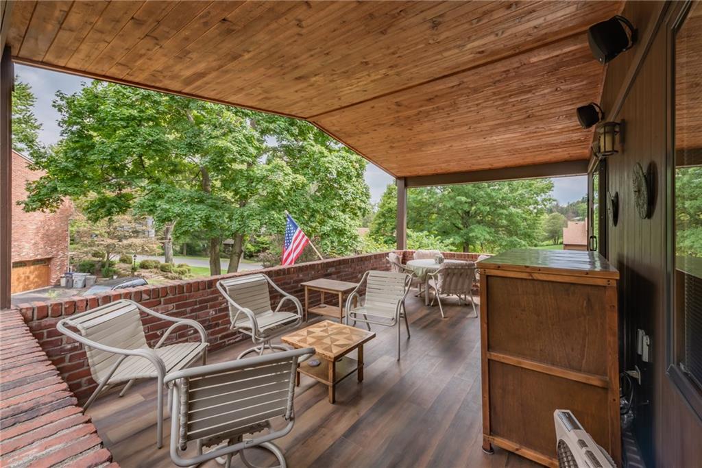421 Center Church Road McMurray, PA 15317 - Photo 21 of 25 COVERED PATIO - Beautiful covered patio with wood plank flooring and a wood covered roof, this space can be enjoyed in all kinds of weather.
