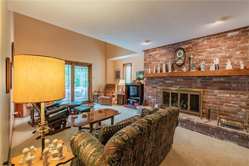 421 Center Church Road McMurray, PA 15317 - Photo 8 of 25 FAMILY ROOM - Main level family room with floor to ceiling brick raised hearth fireplace, the mantle is the perfect space to display your collections and decorate for the holidays. Sliding door leads to the back patio area.
