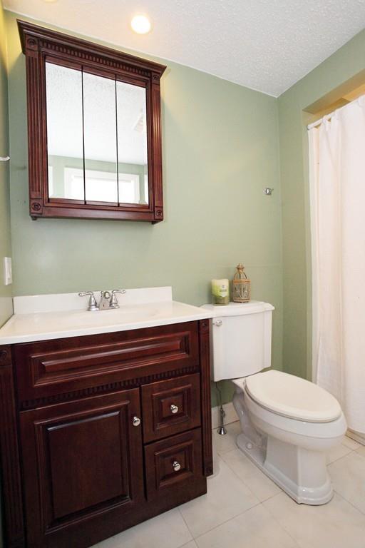 33 Gammons Road Acushnet, MA 02743 - Photo 19 of 37 a bathroom with a toilet a sink and a window