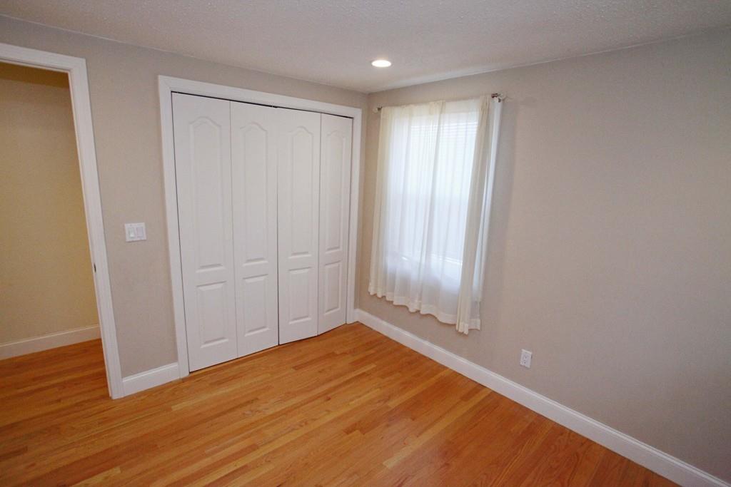 33 Gammons Road Acushnet, MA 02743 - Photo 22 of 37 a view of an empty room and wooden floor