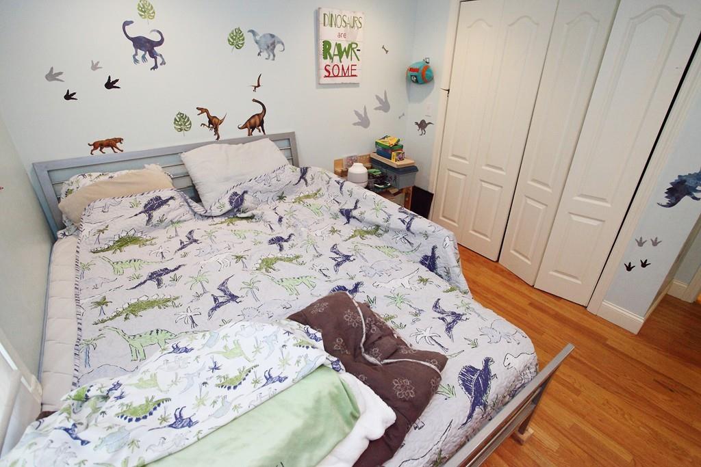 33 Gammons Road Acushnet, MA 02743 - Photo 26 of 37 a bed sitting in a bedroom next to a window