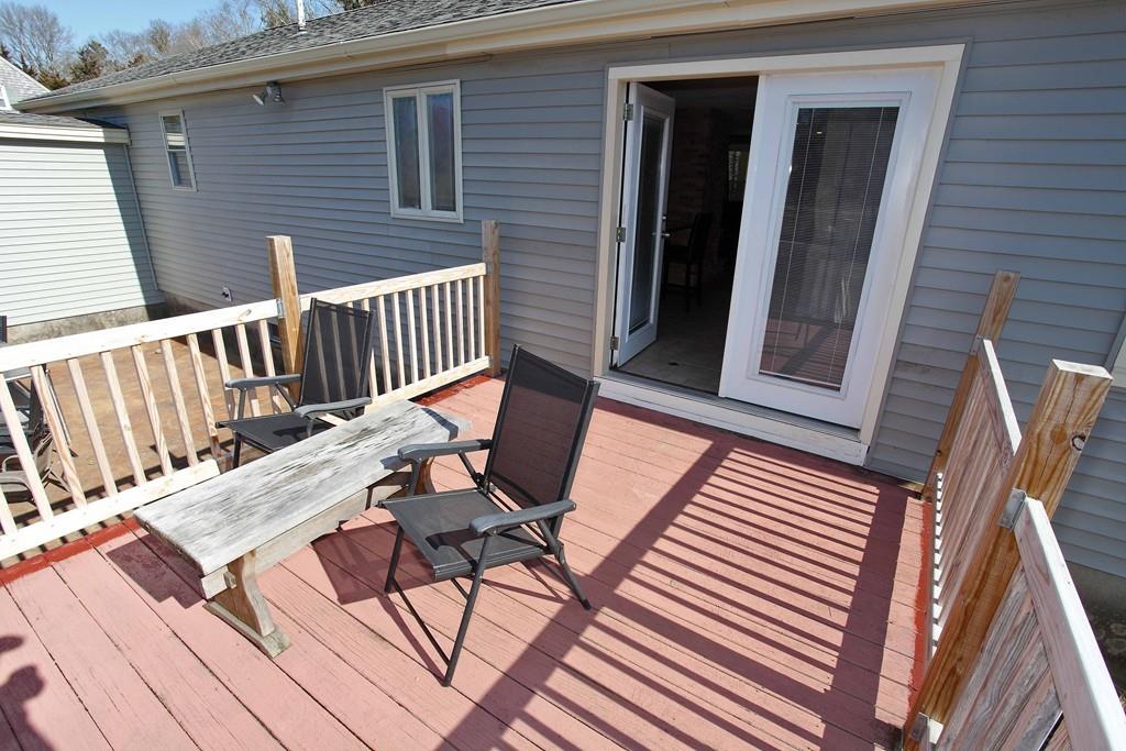 33 Gammons Road Acushnet, MA 02743 - Photo 32 of 37 a view of a patio with a table and chairs