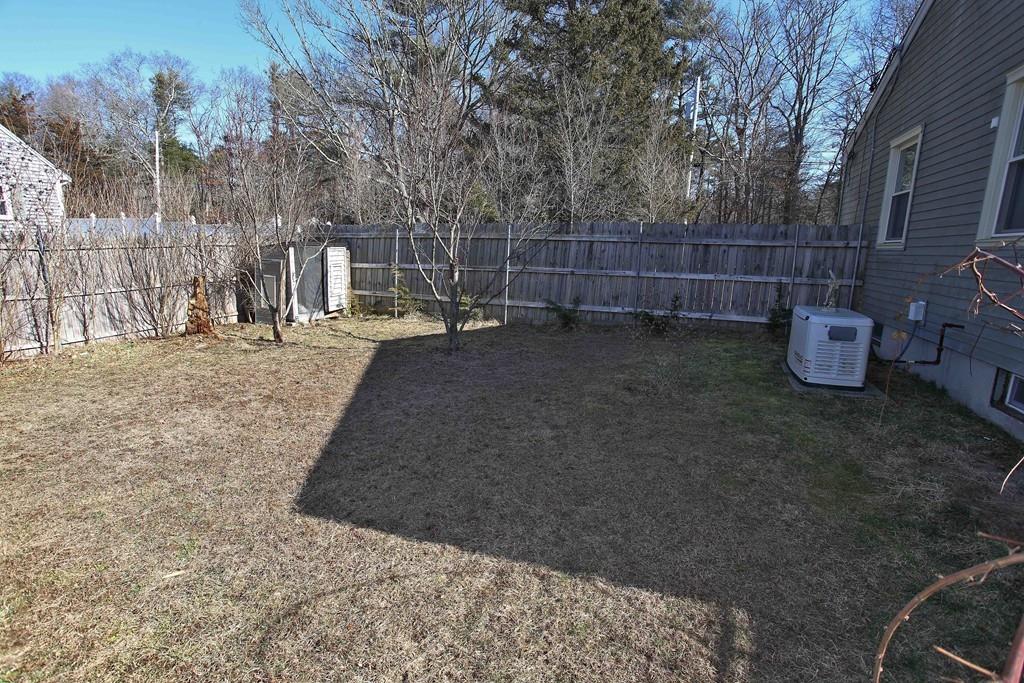 33 Gammons Road Acushnet, MA 02743 - Photo 35 of 37 a view of a backyard with table and chairs