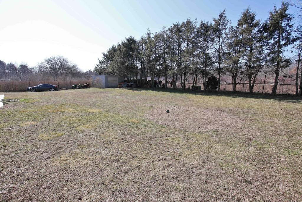 33 Gammons Road Acushnet, MA 02743 - Photo 37 of 37 a backyard of a house with lots of green space