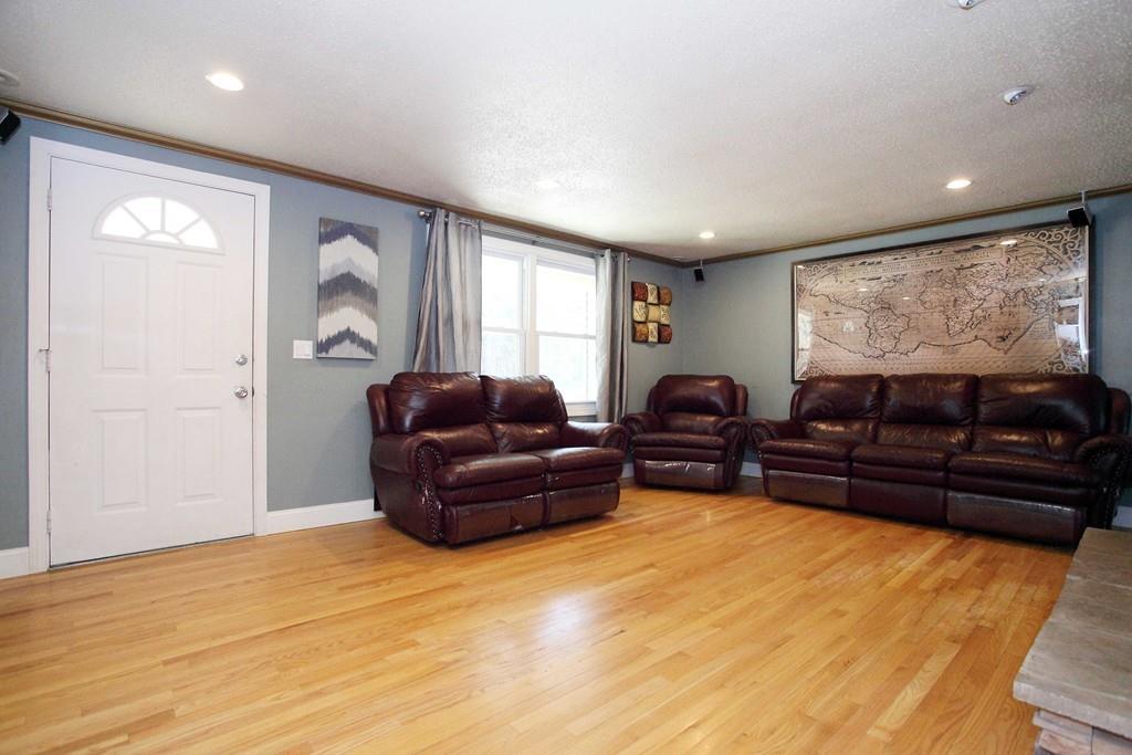 33 Gammons Road Acushnet, MA 02743 - Photo 5 of 37 a living room with furniture and a flat screen tv