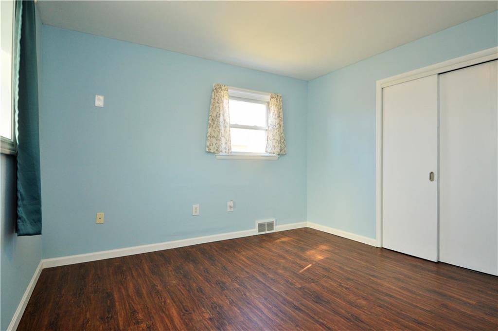 4905 Rochester Road New Brighton, PA 15066 - Photo 11 of 21 an empty room with wooden floor and windows