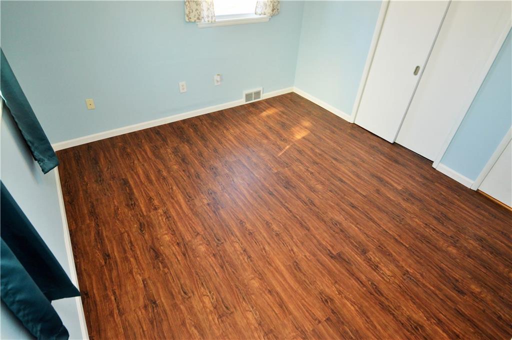4905 Rochester Road New Brighton, PA 15066 - Photo 13 of 21 an empty room with wooden floor