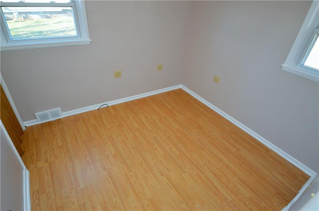 4905 Rochester Road New Brighton, PA 15066 - Photo 14 of 21 a view of a big room with wooden floor and windows