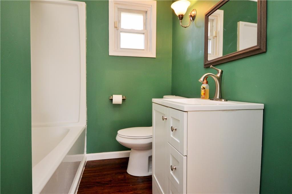 4905 Rochester Road New Brighton, PA 15066 - Photo 15 of 21 a bathroom with a sink toilet and a mirror