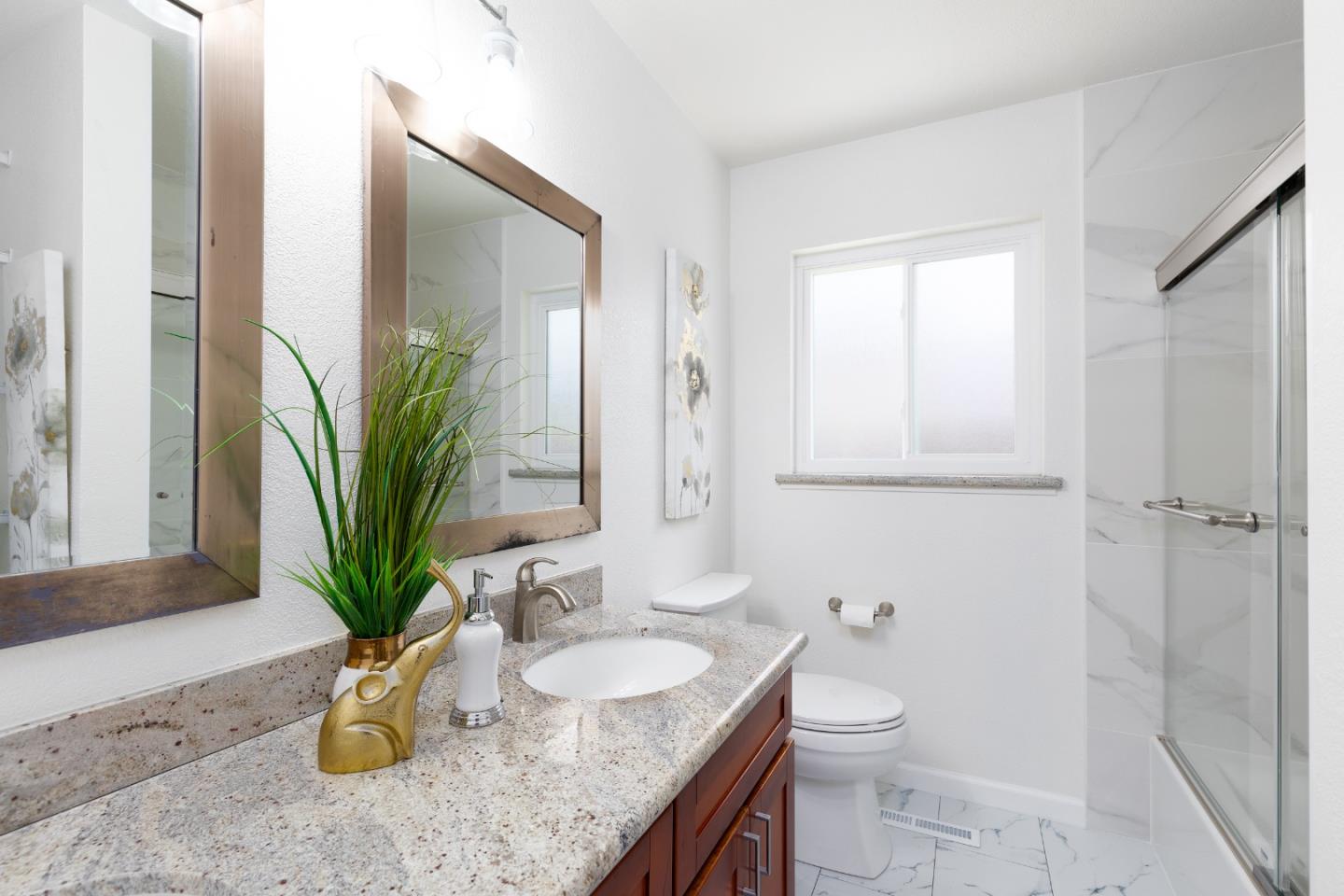 1226 Roxbury Court Santa Clara, CA 95050 - Photo 17 of 35 a bathroom with a granite countertop sink a toilet and with mirror