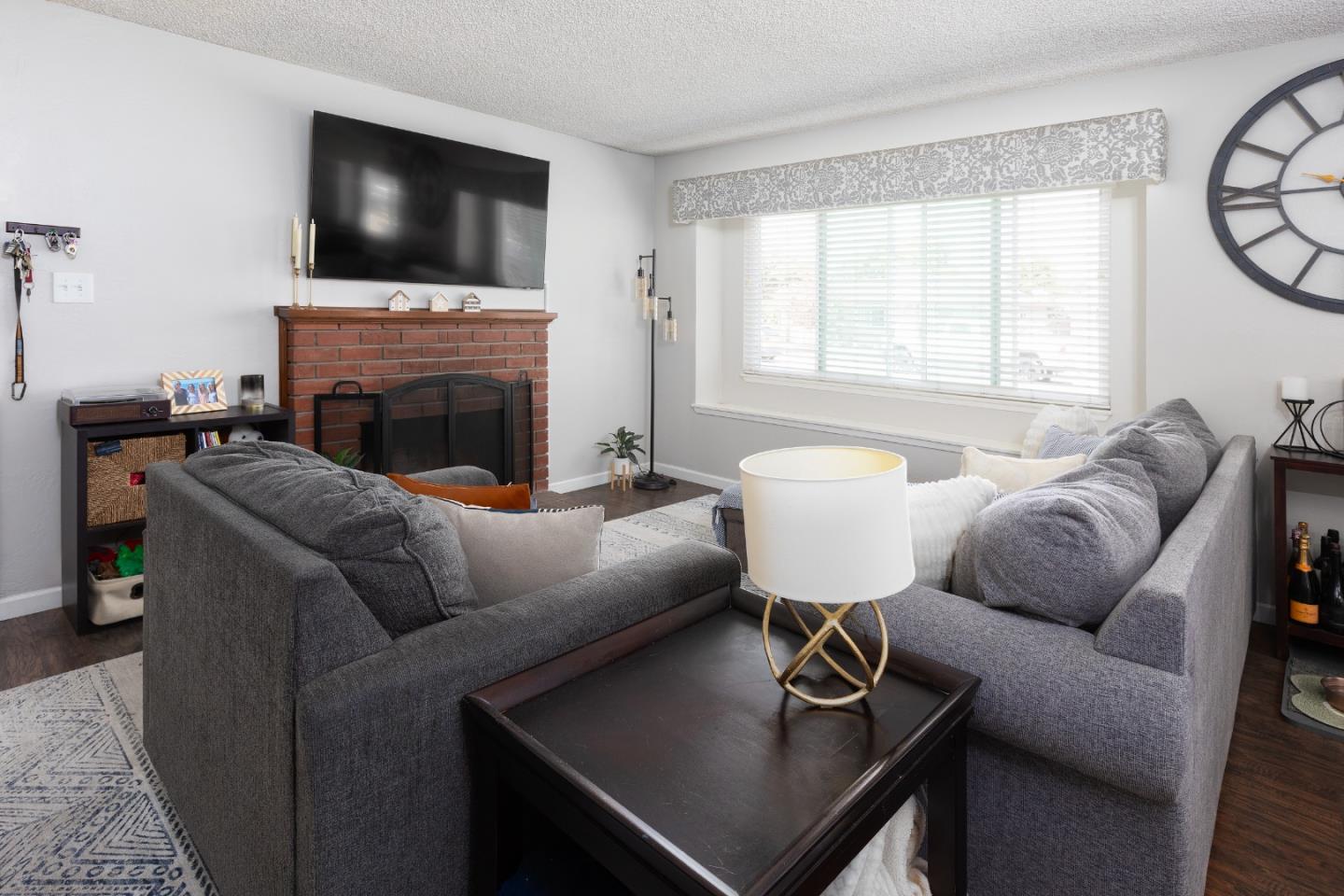 1226 Roxbury Court Santa Clara, CA 95050 - Photo 22 of 35 a living room with furniture and a flat screen tv