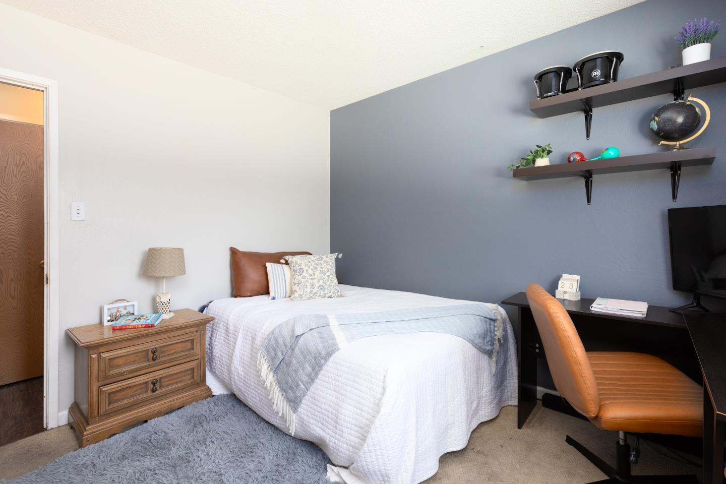 1226 Roxbury Court Santa Clara, CA 95050 - Photo 33 of 35 a bedroom with a bed and chair