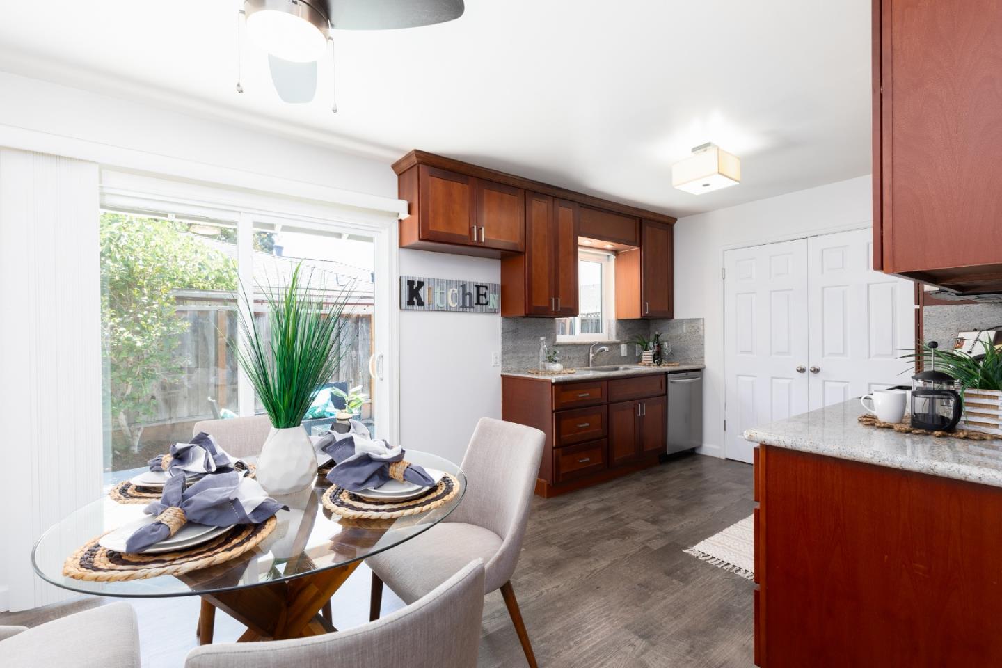 1226 Roxbury Court Santa Clara, CA 95050 - Photo 7 of 35 a kitchen with sink refrigerator dining table and chairs