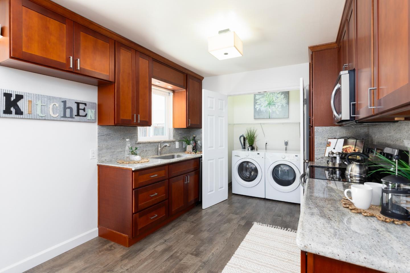 1226 Roxbury Court Santa Clara, CA 95050 - Photo 10 of 35 a kitchen with a stove and a white wooden cabinets