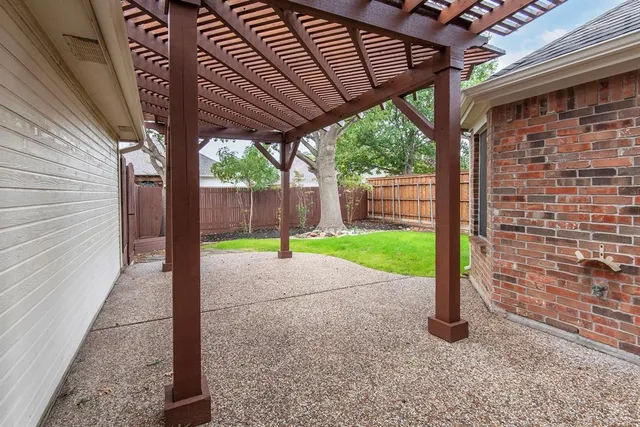 a view of a backyard with a bird bath