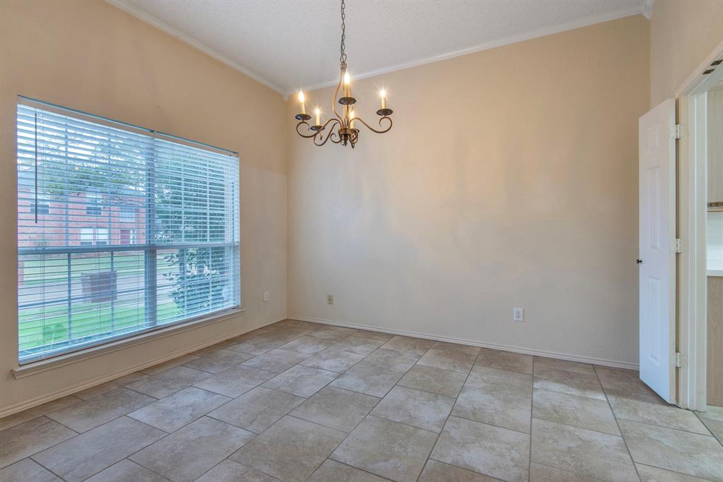 10217 Max Lane Frisco, TX 75035 - Photo 2 of 12 a view of a livingroom with a chandelier fan and windows