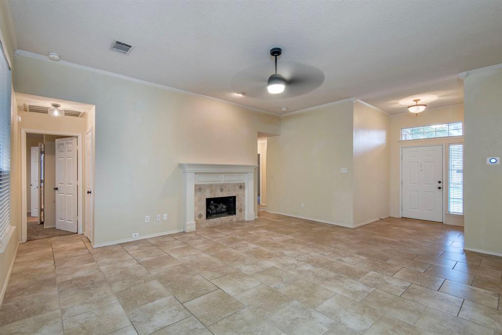 10217 Max Lane Frisco, TX 75035 - Photo 3 of 12 a view of an empty room with a fireplace