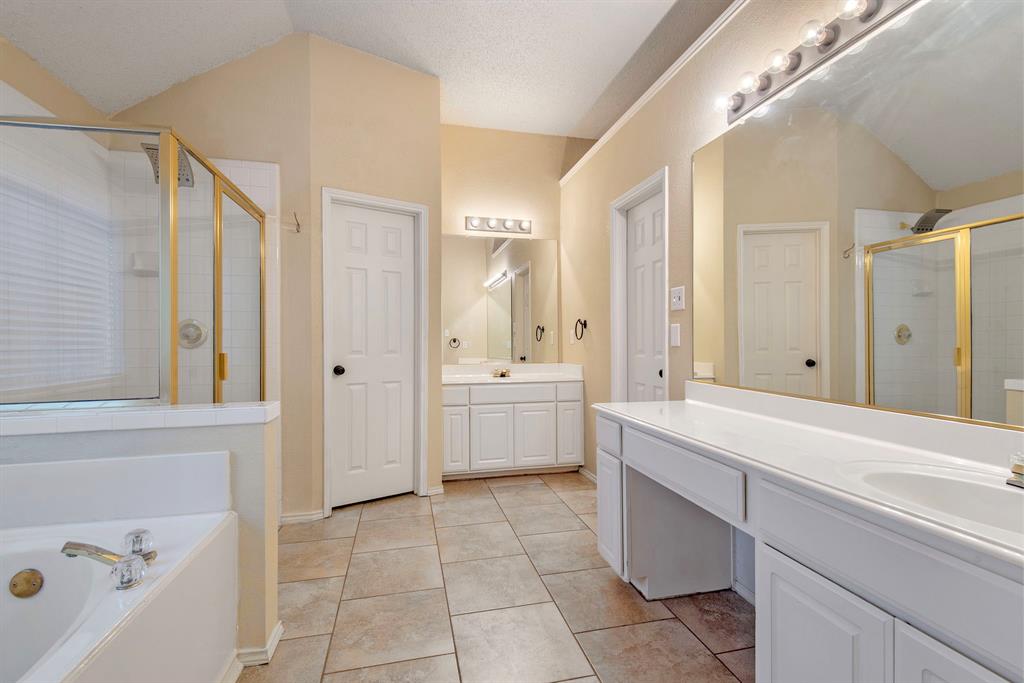 10217 Max Lane Frisco, TX 75035 - Photo 7 of 12 a bathroom with a sink a toilet and a bathtub