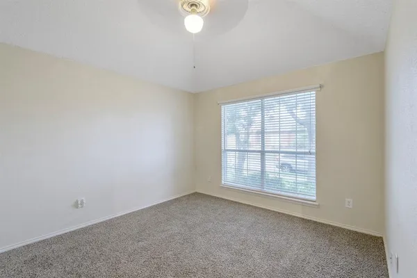 an empty room with a empty space and windows