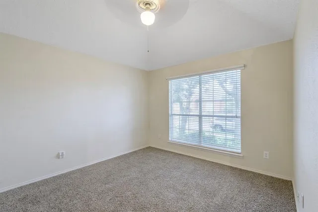 an empty room with a empty space and windows