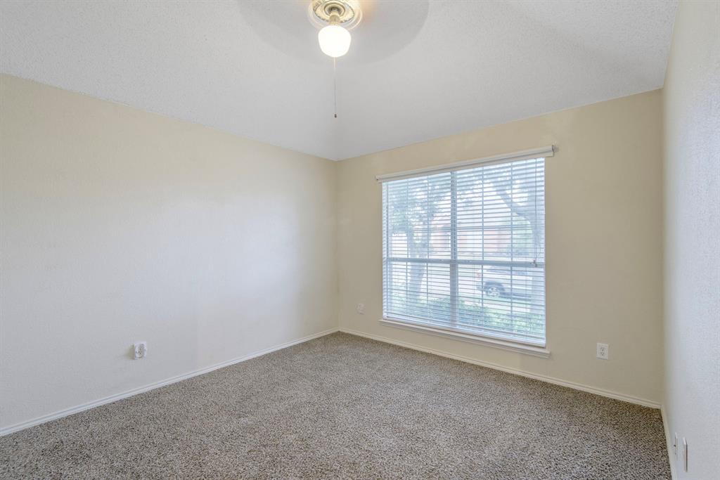 10217 Max Lane Frisco, TX 75035 - Photo 9 of 12 an empty room with a empty space and windows