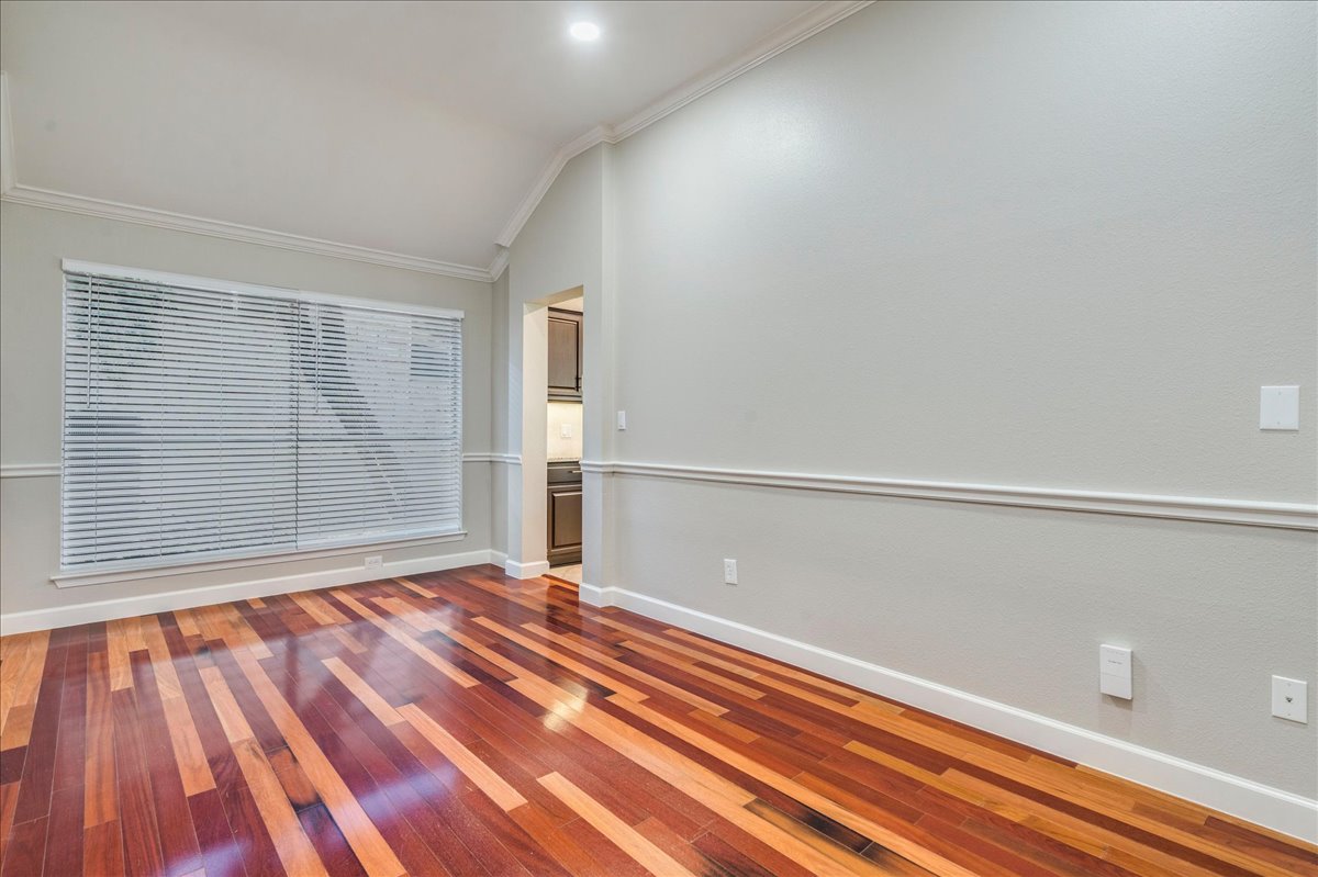 6530 Needham Lane Austin, TX 78739 - Photo 12 of 29 Rich hardwood flooring creates a warm foundation for this versatile dining space.