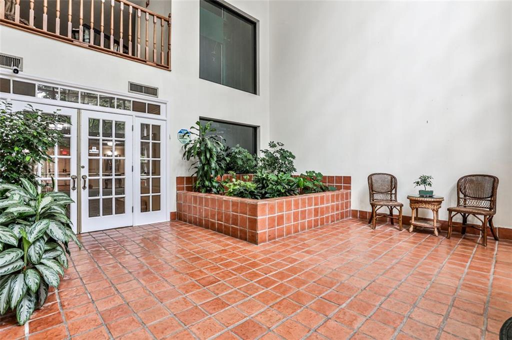 214 Ridley Howard Court Decatur, GA 30030 - Photo 27 of 28 a view of a chairs and table in a backyard